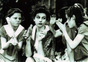 Karen (centre) in the Little Flower Girls School production of Annie in 1992 playing Miss Hannigan with a young Rachel Tucker as Molly